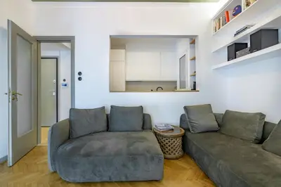 a living room with a couch and a table at Luxurious & Stylish Kolonaki Haven in Athens