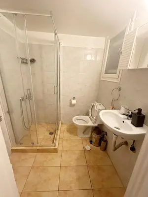 a bathroom with a shower and a toilet and a sink at Check Point - Acropolis Retro in Athens