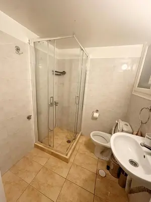 a bathroom with a shower and a toilet and a sink at Check Point - Acropolis Retro in Athens