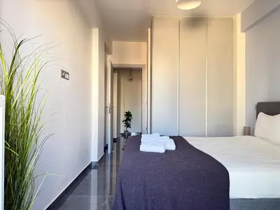a hotel room with a bed with towels on it at Sky Suite Apartments - Cloud9 in the City in Athens