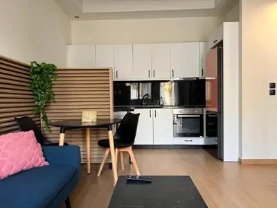a kitchen with a couch and a table in a room at K43 Brand-New Stylish - Cloud9 in the city in Athens