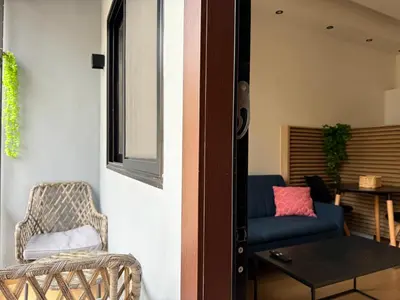 a living room with a blue couch and a table at K43 Brand-New Stylish - Cloud9 in the city in Athens
