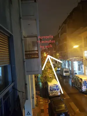 a view of a city street at night with at A pleasant stay near to Acropoli 1A in Athens