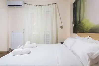 a bedroom with two white beds and a window at A pleasant stay near to Acropoli 1A in Athens