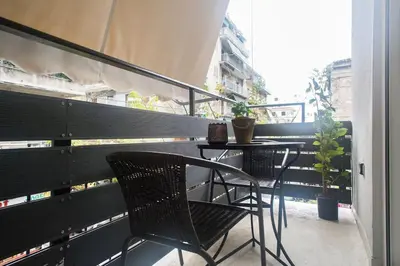 a balcony with a table and chairs on a balcony at A pleasant stay near to Acropoli 1A in Athens