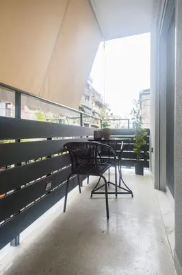 a patio with a table and chairs on a balcony at A pleasant stay near to Acropoli 1A in Athens