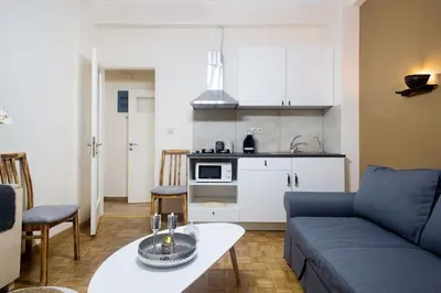 a living room with a couch and a table at A pleasant stay near to Acropoli 1B in Athens