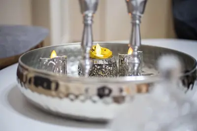 a metal fountain with candles in it on a table at A pleasant stay near to Acropoli 1B in Athens