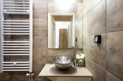 a bathroom with a bowl sink and a mirror at A pleasant stay near to Acropoli 1B in Athens