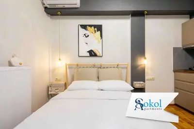 a bedroom with a large white bed in a room at Elegant studio next to Acropolis 2 in Athens