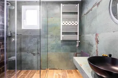 a bathroom with a glass shower and a sink at Holiday close to Acropolis 1 in Athens