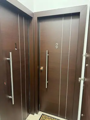 a row of brown lockers in a bathroom at Holiday close to Acropolis 1 in Athens