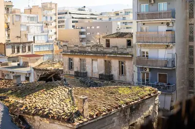 an overhead view of a city with buildings at Holiday close to Acropolis 1 in Athens