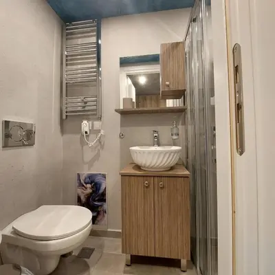 a bathroom with a toilet and a sink at Lux Studio in Ilioupoli, 20 min from Acropolis in Athens