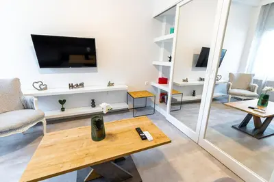 a living room with a tv and a coffee table at Memory in Athens