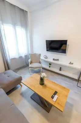 a living room with a couch and a coffee table at Memory in Athens