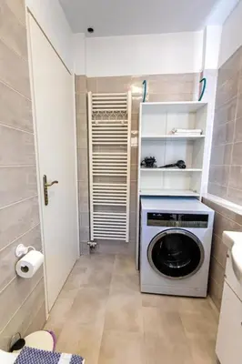 a small bathroom with a washing machine in a room at Memory in Athens