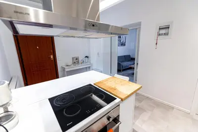 a kitchen with a stove and a counter top at Memory in Athens