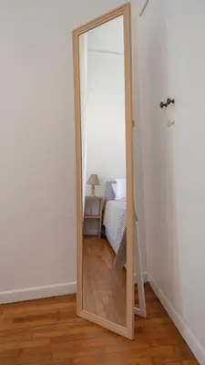 a mirror in the corner of a room with a bed at Amazing View Of Acropolis in Athens