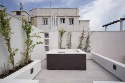 a bath tub on the roof of a building at Plaka House - Boutique Apartments in Athens