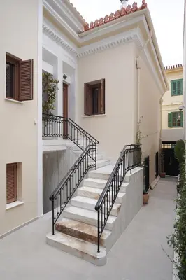 a staircase in a house with white walls at Plaka House - Boutique Apartments in Athens
