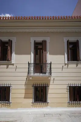 a building with three balconies on the side of it at Plaka House - Boutique Apartments in Athens