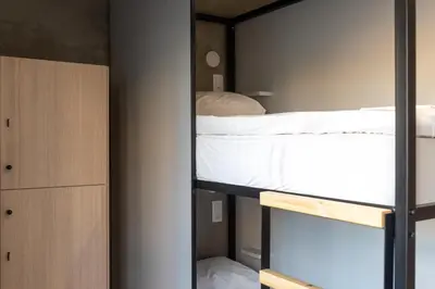 a bedroom with a bunk bed and a closet at Athens Hawks Urban in Athens