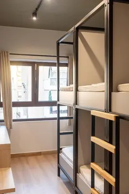 a room with bunk beds with a window at Athens Hawks Urban in Athens