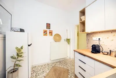 a kitchen with white cabinets and a refrigerator at S37 Acropolis View in Athens