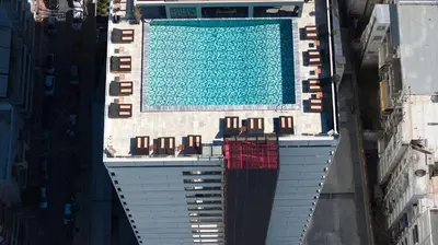 an overhead view of a swimming pool on top of a building at President Hotel Athens in Athens