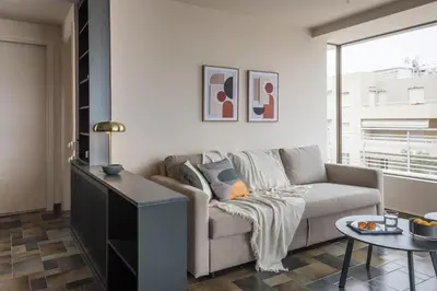a living room with a couch and a table at Wonder Apartment over the Sea in Athens