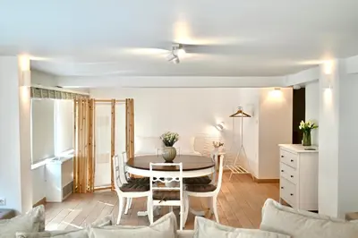 a kitchen and dining room with a table and chairs at Bright and comfy apartment in the heart of Athens in Athens