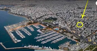 an aerial view of a marina with a yellow arrow at Alimos Cozy Studio in Athens