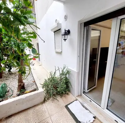 an entrance to a house with a sliding glass door at Alimos Cozy Studio in Athens