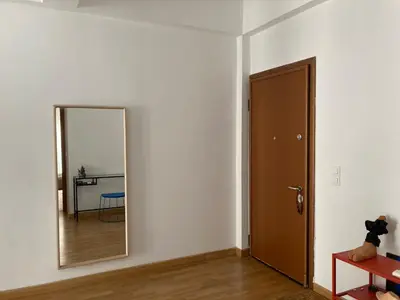 an empty room with a mirror and a door at Jenny's Central Apartment in Athens
