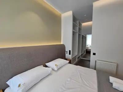 a bedroom with a large bed with two pillows at CAS Athens Center Apartments in Athens