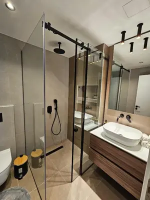a bathroom with a shower and a sink and a toilet at CAS Athens Center Apartments in Athens