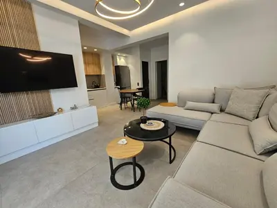 a living room with a couch and a table at CAS Athens Center Apartments in Athens