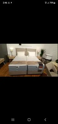 a bedroom with a large bed in a room at Vouliagmeni Kavouri Beach front in Athens