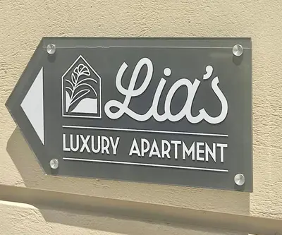 a sign for a lysery appointment on a wall at Lia's luxury apartment - near airport in Koropíon