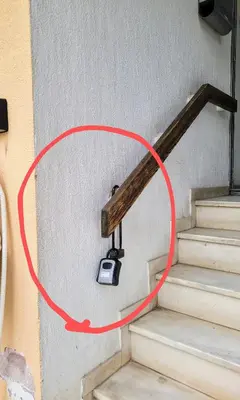 a surveillance camera on the wall next to some stairs at Athens White House in Athens