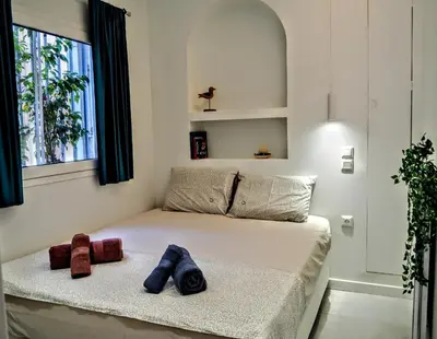 a bedroom with a bed with two teddy bears on it at Athens White House in Athens