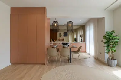a kitchen and dining room with a table and chairs at Acropolis View Plunge Pool Loft in Athens