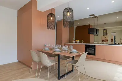 a dining room and kitchen with a table and chairs at Acropolis View Plunge Pool Loft in Athens