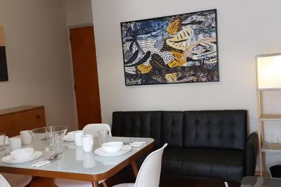 a dining room with a table and a couch at Dalia Apartment- 3 BD,1 BATH in Athens