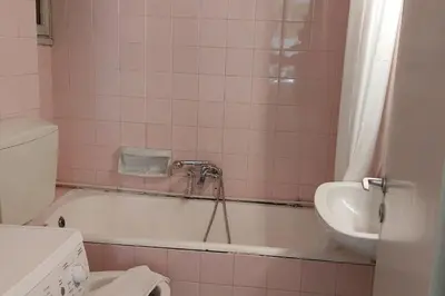 a bathroom with a tub and a sink and a toilet at Dalia Apartment- 3 BD,1 BATH in Athens