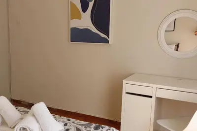 a white room with a mirror and a table at Dalia Apartment- 3 BD,1 BATH in Athens