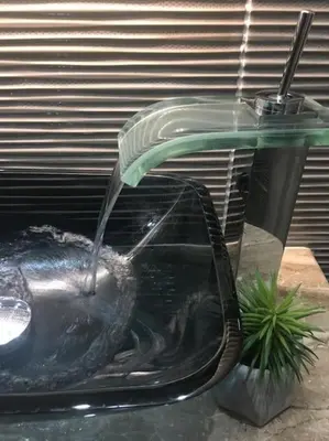 a stream of water pouring into a fish tank at A comfortable small studio nearby Acropolis 4 in Athens
