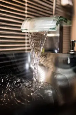 a stream of water coming out of a sink at A comfortable small studio nearby Acropolis 4 in Athens