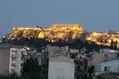 a view ofhenshenshenshenshens acropolis from the roofs of buildings at A comfortable small studio nearby Acropolis 4 in Athens